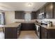 Spacious kitchen with stainless steel appliances and granite countertops that create a functional and elegant cooking space at 5007 Avian Ln, Indianapolis, IN 46235