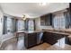 Charming kitchen with granite countertops, stainless steel appliances, and ample cabinet space, perfect for cooking and entertaining at 5007 Avian Ln, Indianapolis, IN 46235
