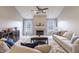 Cozy living room features a fireplace, large windows, and comfortable seating at 5007 Avian Ln, Indianapolis, IN 46235