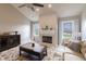 Bright living room featuring a fireplace, neutral decor, and comfortable seating at 5007 Avian Ln, Indianapolis, IN 46235