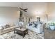 Open-concept living area with comfortable seating, stairs, and dining area at 5007 Avian Ln, Indianapolis, IN 46235