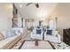 Open-concept living room with neutral tones, stylish furnishings, and stairway access at 5007 Avian Ln, Indianapolis, IN 46235