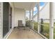 Relaxing screened porch with two chairs, perfect for enjoying the outdoors while staying protected at 5007 Avian Ln, Indianapolis, IN 46235