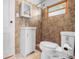 Updated bathroom featuring tiled walls, modern vanity, and tiled shower at 5551 W 200 N, Greenfield, IN 46140