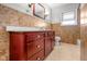 Traditional bathroom featuring a single sink vanity with a toilet and tiled walls at 5551 W 200 N, Greenfield, IN 46140