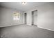 Bright bedroom featuring neutral walls, carpet, a window and closet for ample natural light and storage at 5551 W 200 N, Greenfield, IN 46140
