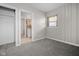 Bright bedroom with closet access, soft carpeting, and natural light from the window at 5551 W 200 N, Greenfield, IN 46140