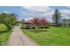 Beautiful home exterior with stone facade and expansive green lawn at 5551 W 200 N, Greenfield, IN 46140