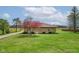 Cozy home with stone exterior, surrounded by lush green lawn and mature trees at 5551 W 200 N, Greenfield, IN 46140