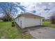 Two car garage with surrounding yard and driveway at 5551 W 200 N, Greenfield, IN 46140