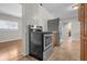 Updated kitchen featuring stainless steel range and refrigerator, and light wood flooring at 5551 W 200 N, Greenfield, IN 46140