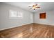 Comfortable living room featuring wood floors, natural light, and a ceiling fan at 5551 W 200 N, Greenfield, IN 46140