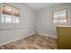 Empty room with wood floors and two large windows that allow for lots of natural light at 5551 W 200 N, Greenfield, IN 46140