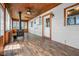 Inviting sunroom with rustic wood accents, a cozy wood-burning stove, and natural light at 5551 W 200 N, Greenfield, IN 46140