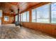 Wood paneled sunroom with wood stove, plank flooring and view at 5551 W 200 N, Greenfield, IN 46140