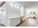 Stylish bar area with a textured wall, white countertop and storage cabinets with a beverage refrigerator at 5682 Upper Garden Way, Zionsville, IN 46077