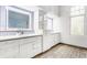 Bright bathroom with a double vanity, modern fixtures, blue backsplash, and a patterned rug at 5682 Upper Garden Way, Zionsville, IN 46077