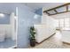 Spacious bathroom featuring a shower, blue tiling, hardwood floors, and storage at 5682 Upper Garden Way, Zionsville, IN 46077