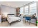 A well-lit bedroom with a single bed, desk, and unique decorative shelves at 5682 Upper Garden Way, Zionsville, IN 46077
