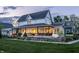 A beautiful two-story house featuring a covered porch, manicured lawn, and charming curb appeal at 5682 Upper Garden Way, Zionsville, IN 46077