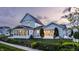 A beautiful two-story house featuring a patio and meticulously maintained landscaping at 5682 Upper Garden Way, Zionsville, IN 46077