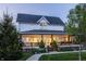Charming two-story home features a spacious front porch, well-manicured lawn, and inviting curb appeal at 5682 Upper Garden Way, Zionsville, IN 46077