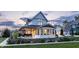 A beautiful two-story house featuring a patio and meticulously maintained landscaping at 5682 Upper Garden Way, Zionsville, IN 46077