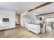 Bright, open-concept kitchen and dining area with stainless steel appliances and hardwood flooring at 5682 Upper Garden Way, Zionsville, IN 46077
