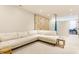 Basement living area with a comfortable L-shaped sofa, rock climbing wall, and modern decor at 5682 Upper Garden Way, Zionsville, IN 46077