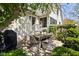Outdoor dining area with seating, a table, and landscaped backyard view at 5946 N New Jersey St, Indianapolis, IN 46220