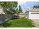 Spacious backyard featuring a trampoline, green lawn, and partially fenced perimeter at 5946 N New Jersey St, Indianapolis, IN 46220