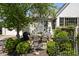 Charming outdoor dining area with a table and chairs, surrounded by lush greenery at 5946 N New Jersey St, Indianapolis, IN 46220