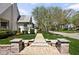 Charming home exterior with walkway, well-maintained lawn and mature landscaping at 5946 N New Jersey St, Indianapolis, IN 46220