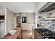 Bright kitchen with marble countertops, stainless steel appliances, wooden floors and ample storage space at 5946 N New Jersey St, Indianapolis, IN 46220