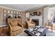 Sophisticated living room with hardwood floors, fireplace, decorative furnishings, and natural light at 5946 N New Jersey St, Indianapolis, IN 46220