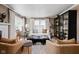 Inviting living room with hardwood floors, a comfortable sofa, and ample natural light at 5946 N New Jersey St, Indianapolis, IN 46220