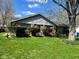 Charming single-story home with mature trees, lush lawn, and well-maintained landscaping in a suburban setting at 6040 Ipswich Ct, Indianapolis, IN 46254