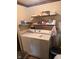 Laundry room featuring a washer, dryer, shelving, and storage for household essentials at 6040 Ipswich Ct, Indianapolis, IN 46254