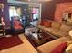 Comfortable living room with plush sofa, accent chair, and dining area beyond, great for entertaining at 6040 Ipswich Ct, Indianapolis, IN 46254