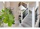 Elegant foyer with staircase, neutral walls and stylish lighting fixtures at 6054 Easy Ln, Indianapolis, IN 46259