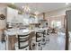 Bright, open kitchen with a large island, white cabinets, and pendant lighting at 6054 Easy Ln, Indianapolis, IN 46259