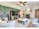 Cozy living room with a fireplace, comfortable seating, and natural light at 6054 Easy Ln, Indianapolis, IN 46259