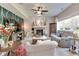Cozy living room with a fireplace, comfortable seating, and natural light at 6054 Easy Ln, Indianapolis, IN 46259