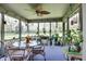 Enclosed patio offering outdoor seating with a ceiling fan and natural light; great for relaxing and entertaining at 6054 Easy Ln, Indianapolis, IN 46259