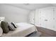 Bedroom features hardwood floors, neutral décor, and ample storage space with a double closet at 611 Tecumseh St, Indianapolis, IN 46201