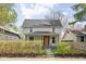 Charming two-story home featuring a cozy front porch and well-maintained landscaping at 611 Tecumseh St, Indianapolis, IN 46201