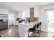 Modern kitchen with stainless steel appliances and a breakfast bar at 611 Tecumseh St, Indianapolis, IN 46201