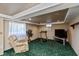 Finished basement with exercise equipment and space for entertainment or relaxation at 614 Debra Ln, Indianapolis, IN 46217
