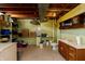 Unfinished basement with utility sink and toilet next to lots of storage shelving at 614 Debra Ln, Indianapolis, IN 46217