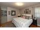 Cozy bedroom featuring a comfortable bed, neutral decor, and soft natural light from the window at 614 Debra Ln, Indianapolis, IN 46217